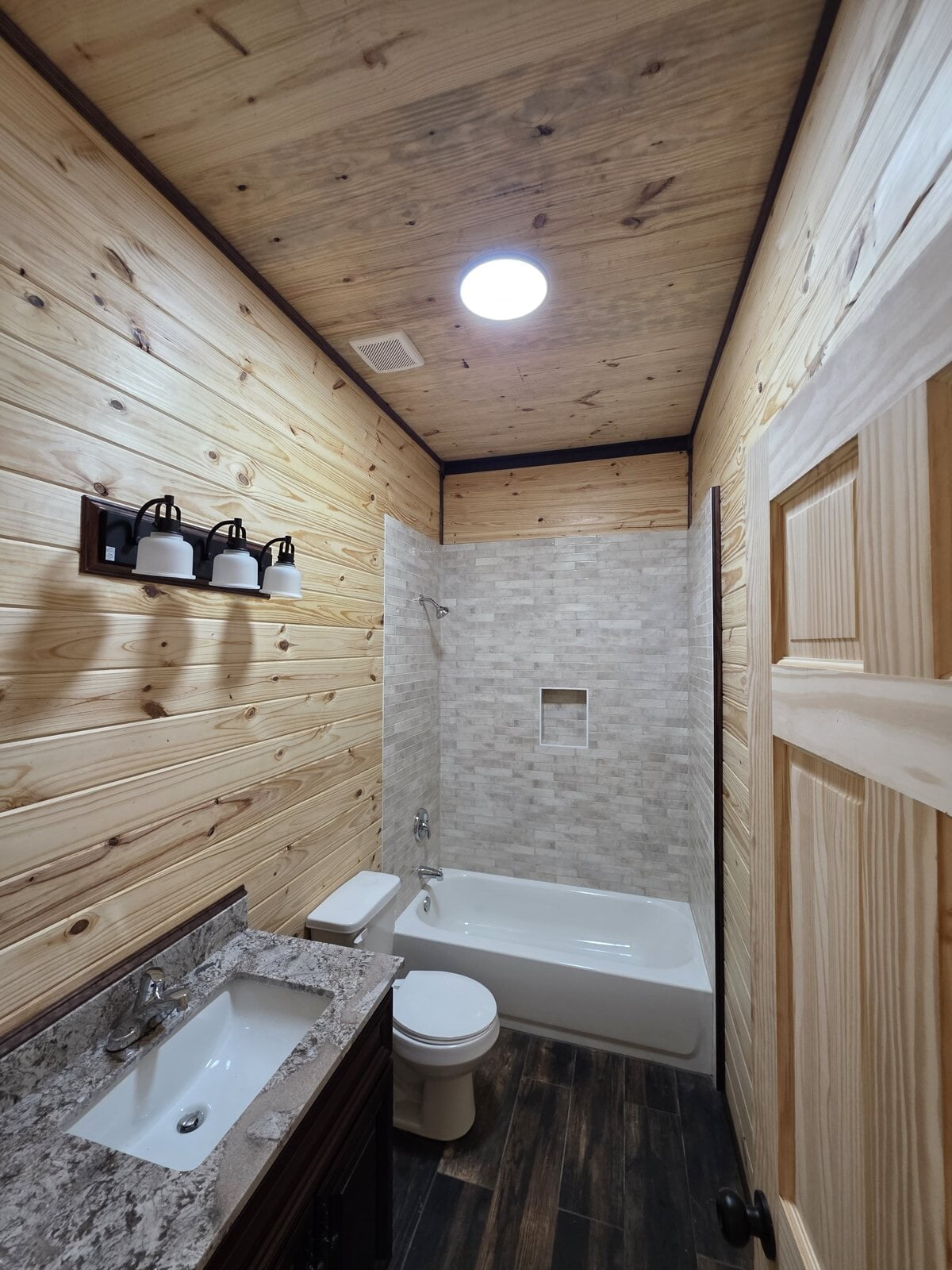 Bathroom vanity lighting, exhaust fan and ceiling light wired in a new Angleton, TX home