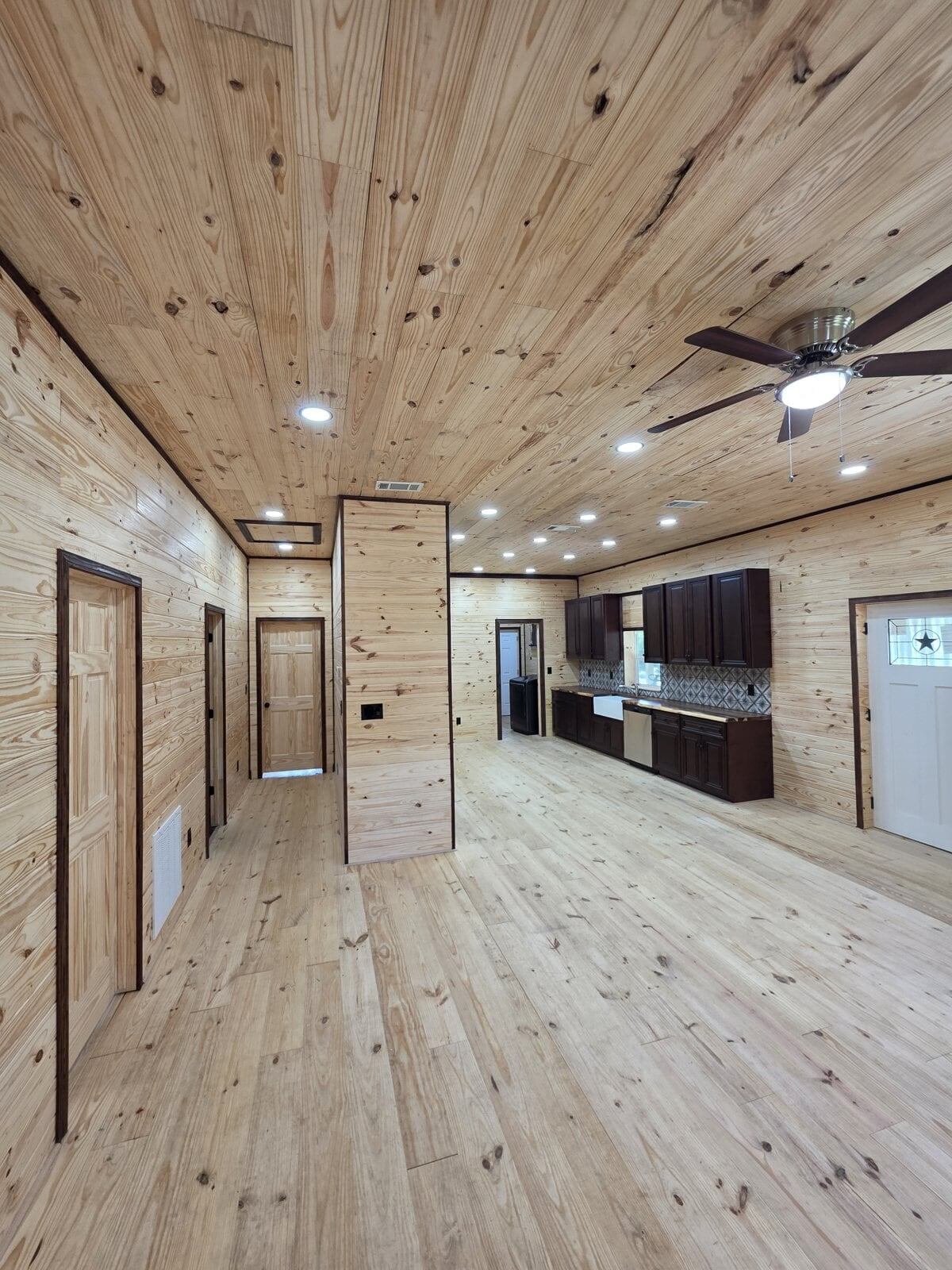 New construction home in Angleton, TX wired by Ivy Leach Electrical - recessed lighting and ceiling fan in the living area
