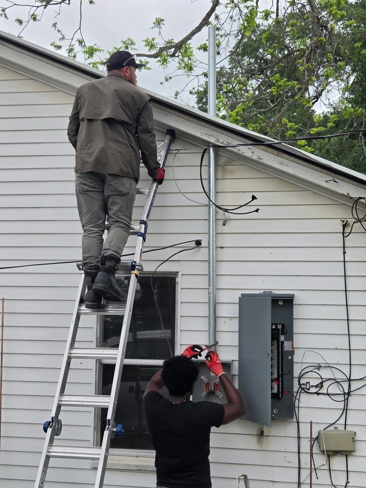 Ivy Leach Electrical electricians completing an electrical service upgrade with a new panel and meter base on a home in Clute, TX